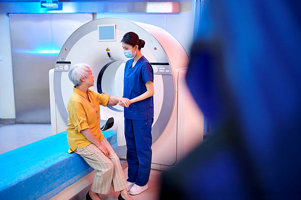 istock Female Nurse Communication & Talking to Patient 2221255026