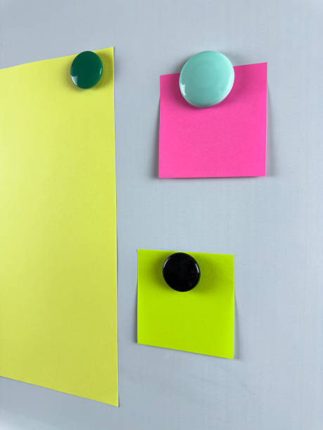 istock Notes pinned to whiteboard with magnets suitable for tracking tasks reminders and planning. Ideal for educational and professional settings enhancing organizational skills 2221264599
