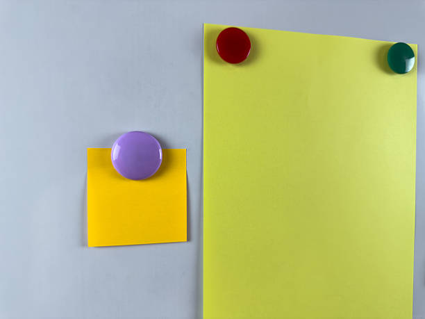 istock Whiteboard with various notes attached by magnets perfect for organizing tasks and reminders. Increasing productivity and efficiency in office. Classroom education with notes 2221264604