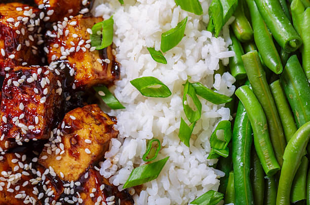 istock fried tofu with sesame seeds, rice and green beans as background 2221266721