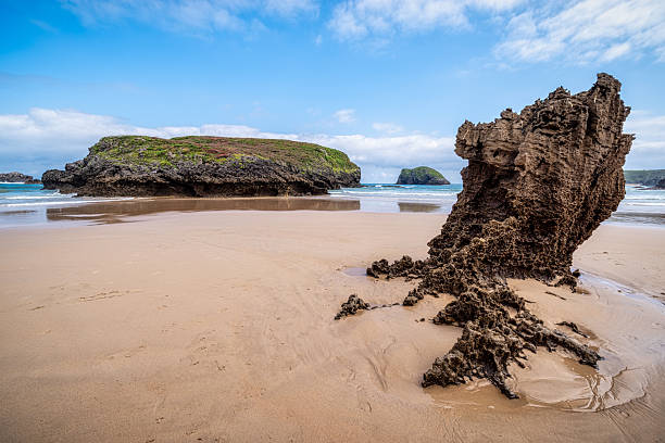 Stunning view of the unique rock formations on Barro beach, a beautiful natural landscape located in Llanes, Asturias, Spain, showcasing the power of erosion on the coastline