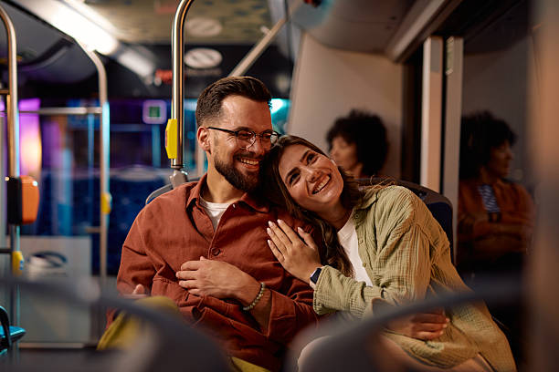 istock Young couple enjoying a relaxing bus ride at night 2221272595