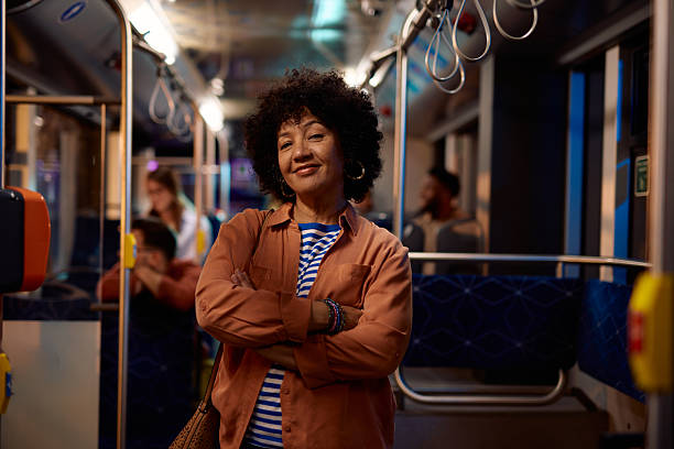 istock Confident mature woman commuting on a bus at night 2221272600