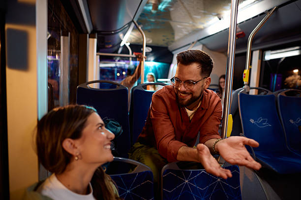 istock Young couple talking and having fun while traveling by bus 2221272682