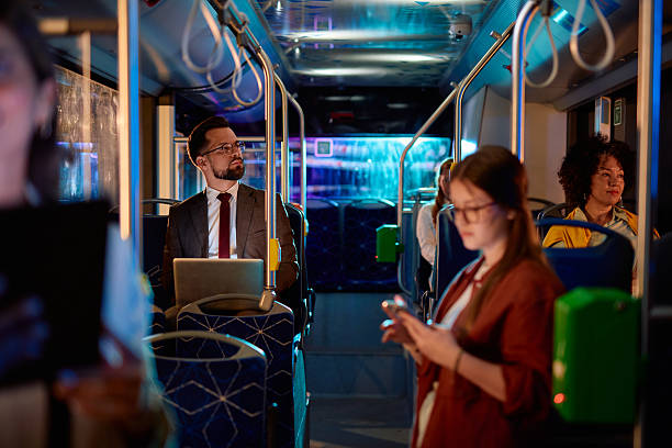 istock Diverse group of people commuting by bus at night 2221272799