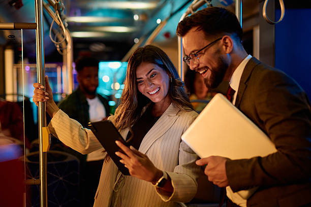 istock Business people using digital tablet and laptop on bus at night 2221272833