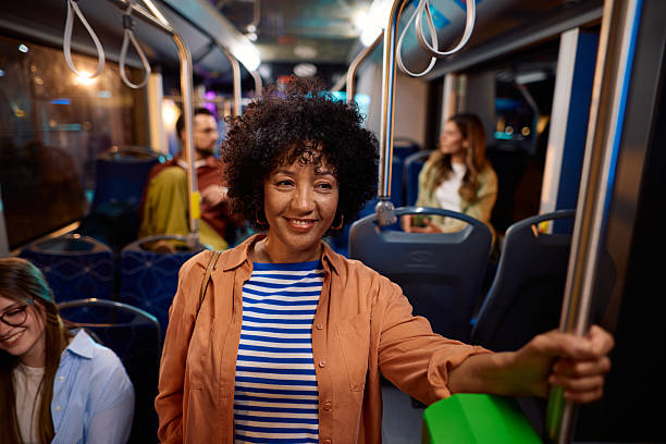 istock Woman commuting by bus looking at camera and smiling 2221272862