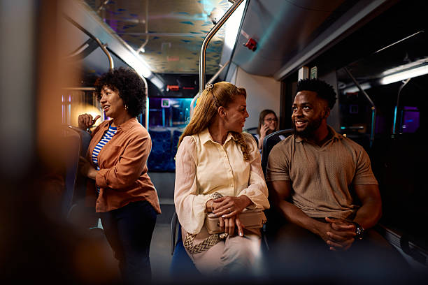 istock Passengers chatting and enjoying their bus ride at night 2221273106