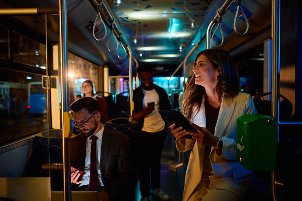 istock Young businesswoman using tablet while commuting by bus at night 2221273421
