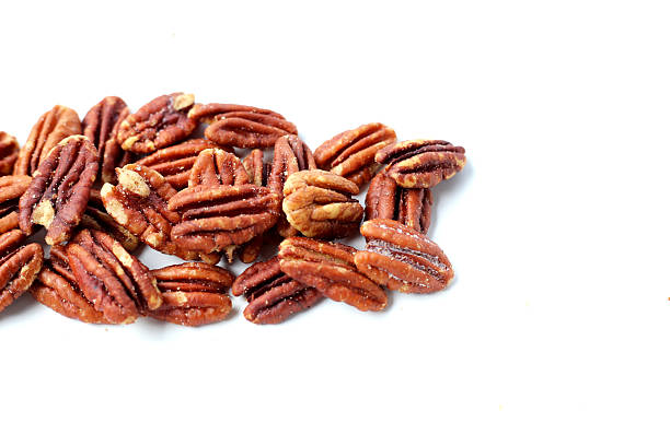 istock Delicious salted pecan nuts scattered. 2221274755