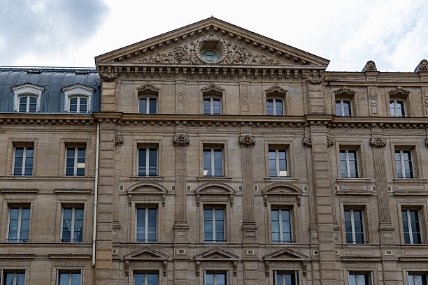 istock Building Facade with Multiple Windows and Ornate Details 2221275634