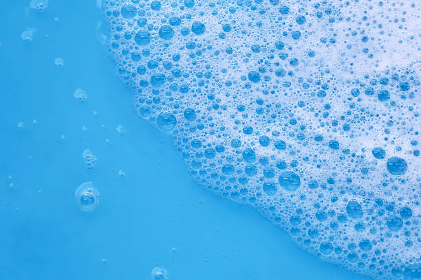istock Blue water with white foam bubbles 2221275739