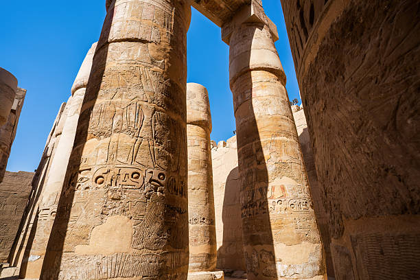 istock Towering ancient columns of Karnak Temple's Great Hypostyle Hall in Luxor, Egypt, showcasing intricate hieroglyphics 2221277755