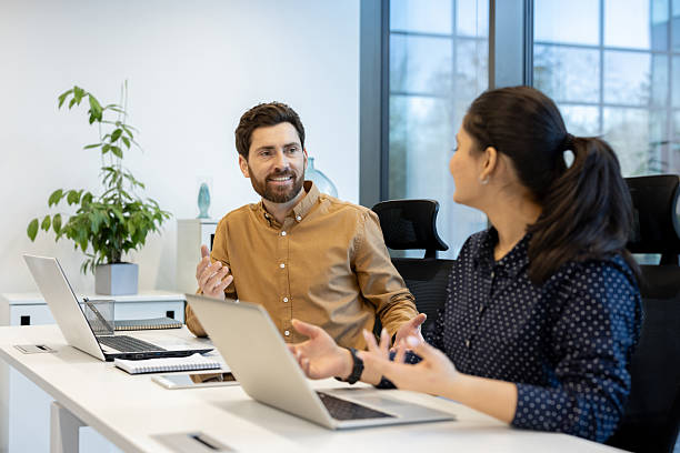 istock Two colleagues are having a productive conversation during a meeting at their office 2221280814