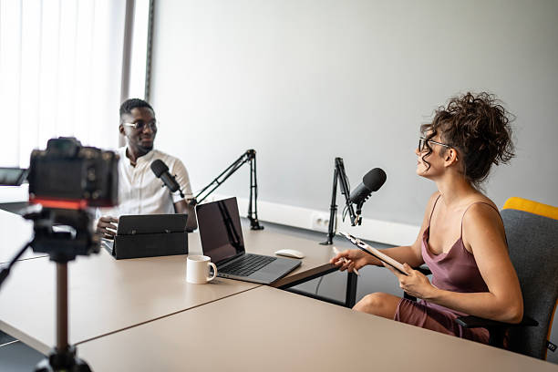istock Two Professionals Recording a Podcast in a Modern Studio Setting 2221294956