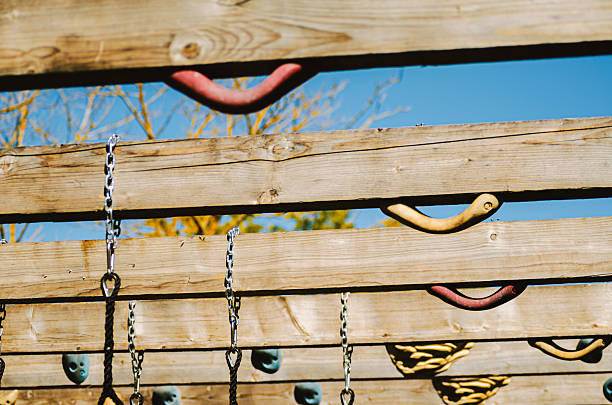 Outdoor Obstacle Course Structure with Wooden Beams and Climbing Holds.