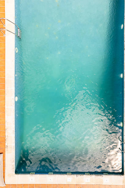 Top Down Aerial View of a Swimming Pool with Turquoise Water, aerial drone top down view