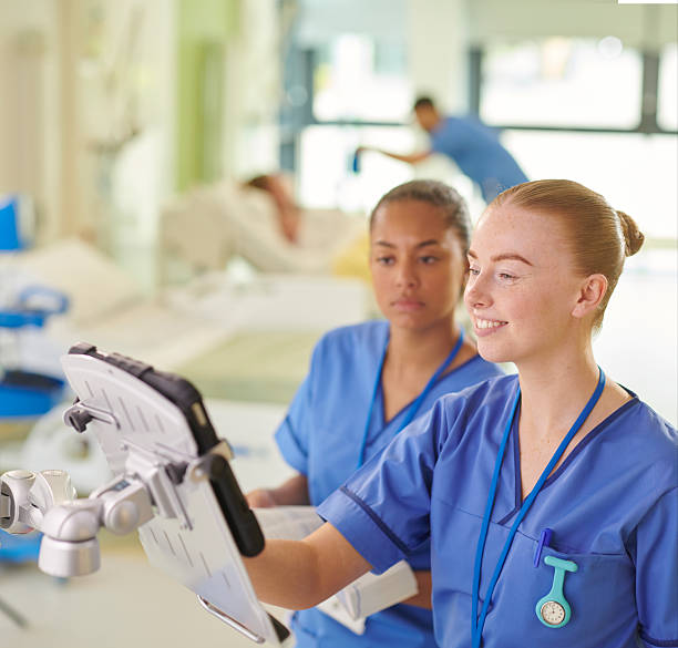 istock student nurse with her mentor on the medicine trolley 2221308805