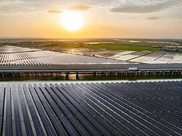 istock Solar photovoltaic panels and highway 2221309900