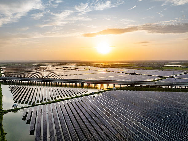 istock Solar photovoltaic panels and highway 2221309966