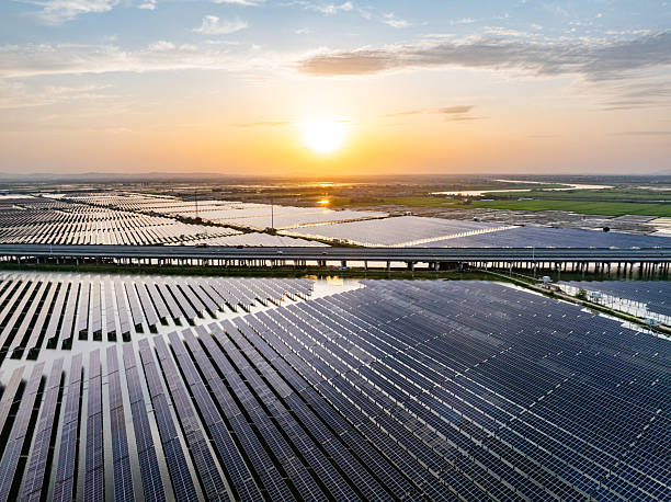 istock Solar photovoltaic panels and highway 2221310234