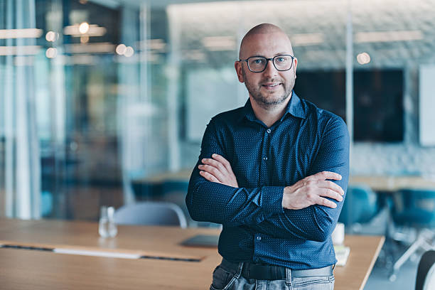 istock Confident middle age businessman standing in the office 2221313668