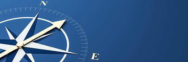 istock Golden compass arrow on blue background symbolizing direction, navigation, and business guidance with space for text or promotional content. 3D Rendering 2221325133