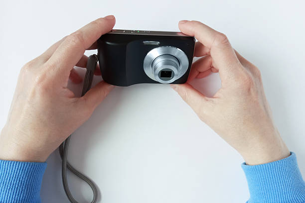 two retro 35mm film cameras and a photo album for close-up photos, on a white background