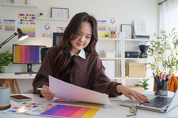 istock Graphic designer reviewing color samples for design project in creative office. 2221327661