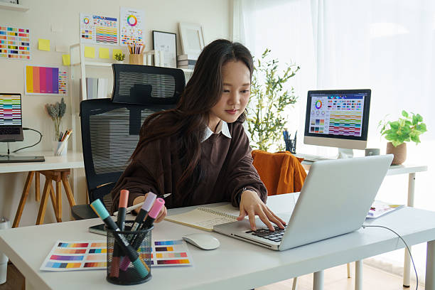 istock Graphic designer planning design work at a creative desk. 2221327662