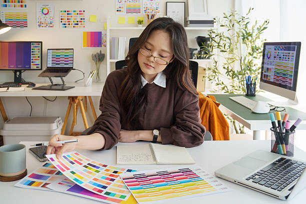 istock Graphic designer reviewing color samples for design project in creative office. 2221327674