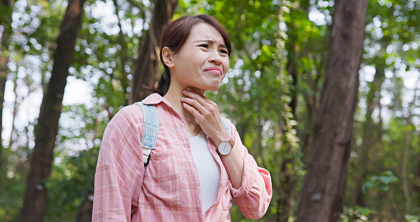 istock Sick with Sore Throat in Forest 2221330843