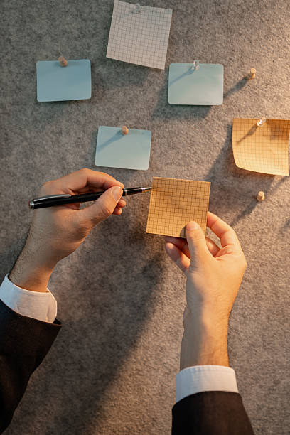 istock chart-based statistical data is prepared by accounting staff to present the company's income and expenditure data, a businessman prepares marketing and financial information for presentation 2221334637