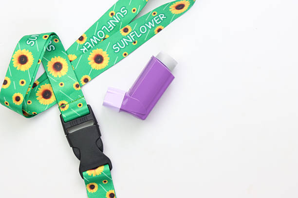istock Hidden disability lanyard with a asthma device in a light background 2221337882