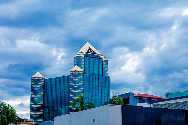 SCB thai bank headquartes and bank park at Ratchadaphisek Road in Bangkok Chatuchak in overcast dramatic sky. View from Pahonyothin Road at early evening
