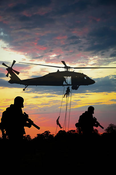 istock Conceptual image of war with sunset and soldier silhouette 2221340091
