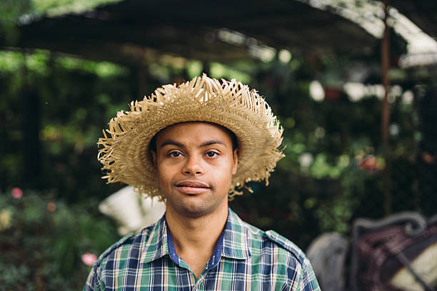istock Young man with Down syndrome working in plant shop 2221340193