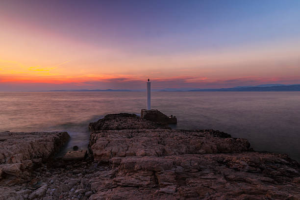 istock Tranquil Sunset by the Adriatic – Stone Pier & Lighthouse 2221341631