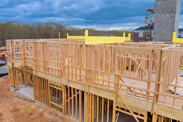 istock Construction process of wooden frame building under works day in suburban area 2221345876