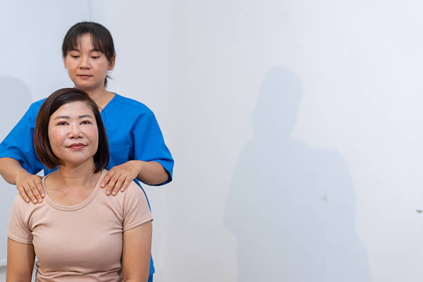 istock Woman receives relaxing shoulder massage from therapist 2221348241