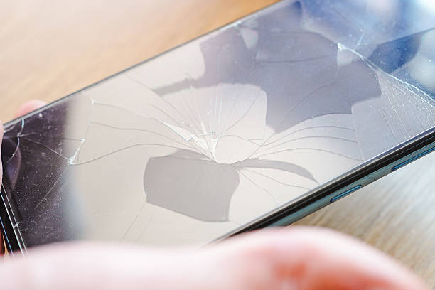 istock Close-up of broken cell phone screen 2221348504