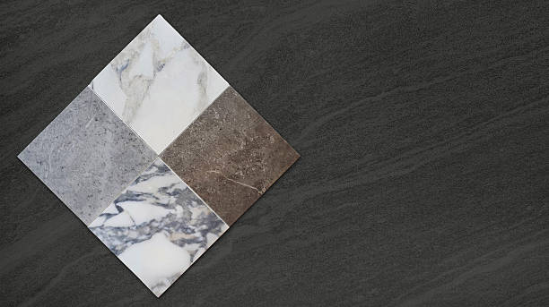 istock white, grey and brown tile samples collection placed on dark black marble stone with blank space for design. luxury marble and stone ceramic tile for flooring ,counter top ,back splash works. 2221352123