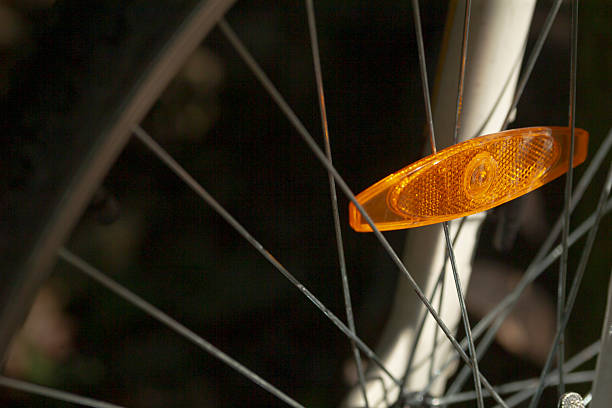 istock A closeup of a bicycle wheel with a bright reflector attached 2221356467