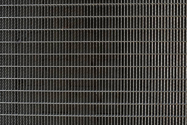 A background image of a corridor built from gray steel grating panels.