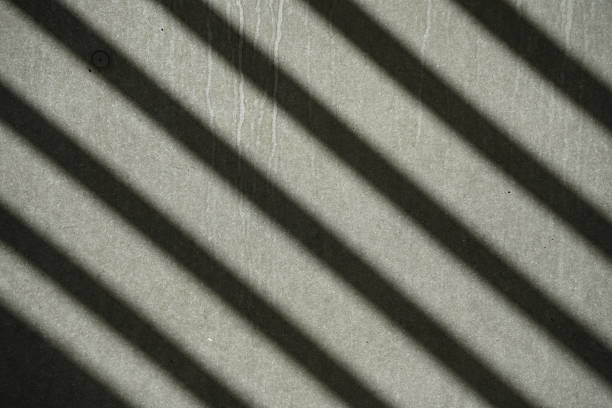 istock Light and shadow wallpaper diagonal strips. Geometric diagonal pattern of shadow on roughness shingles black texture 2221369164