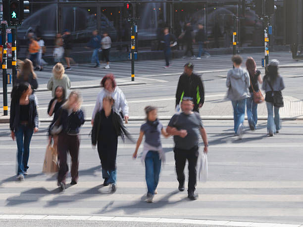istock Pedestrians at a zebra crossing 2221375136