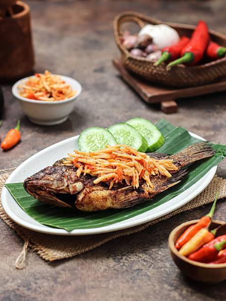 istock Ikan Goreng sambal pencit mangga muda or fried fish with young mango chili paste. 2221381197