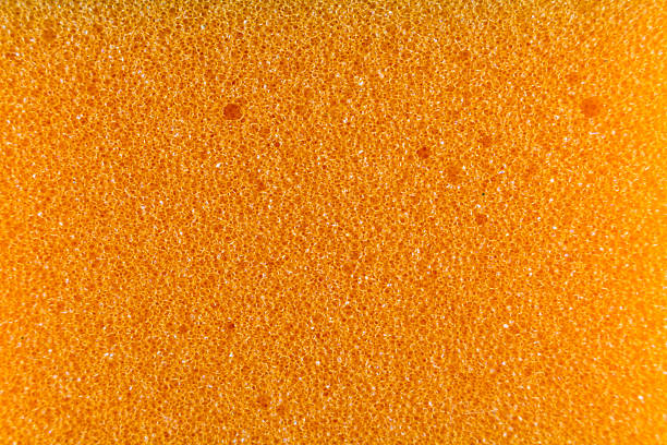 istock Orange sponge made of microfiber material. Texture, background. In Increase 2221388578