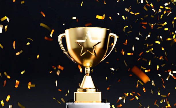 istock Gold star trophy with confetti explosion 2221396001