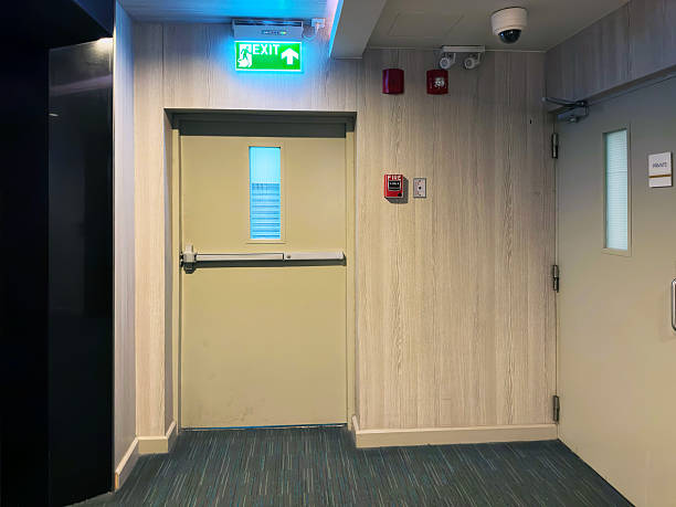 istock Close up emergency exit door in office building interior 2221404925